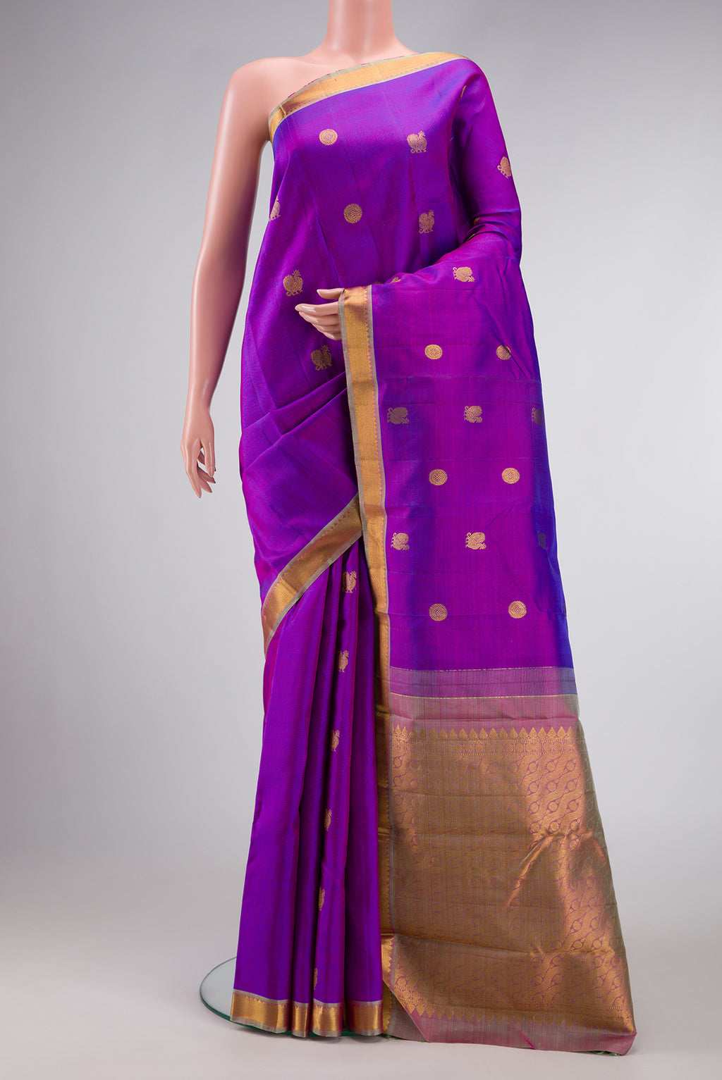 Purple Dual Tone Kanchipuram Silk Saree with Zari Butta on the body and Zari Border.  displayed on a mannequin