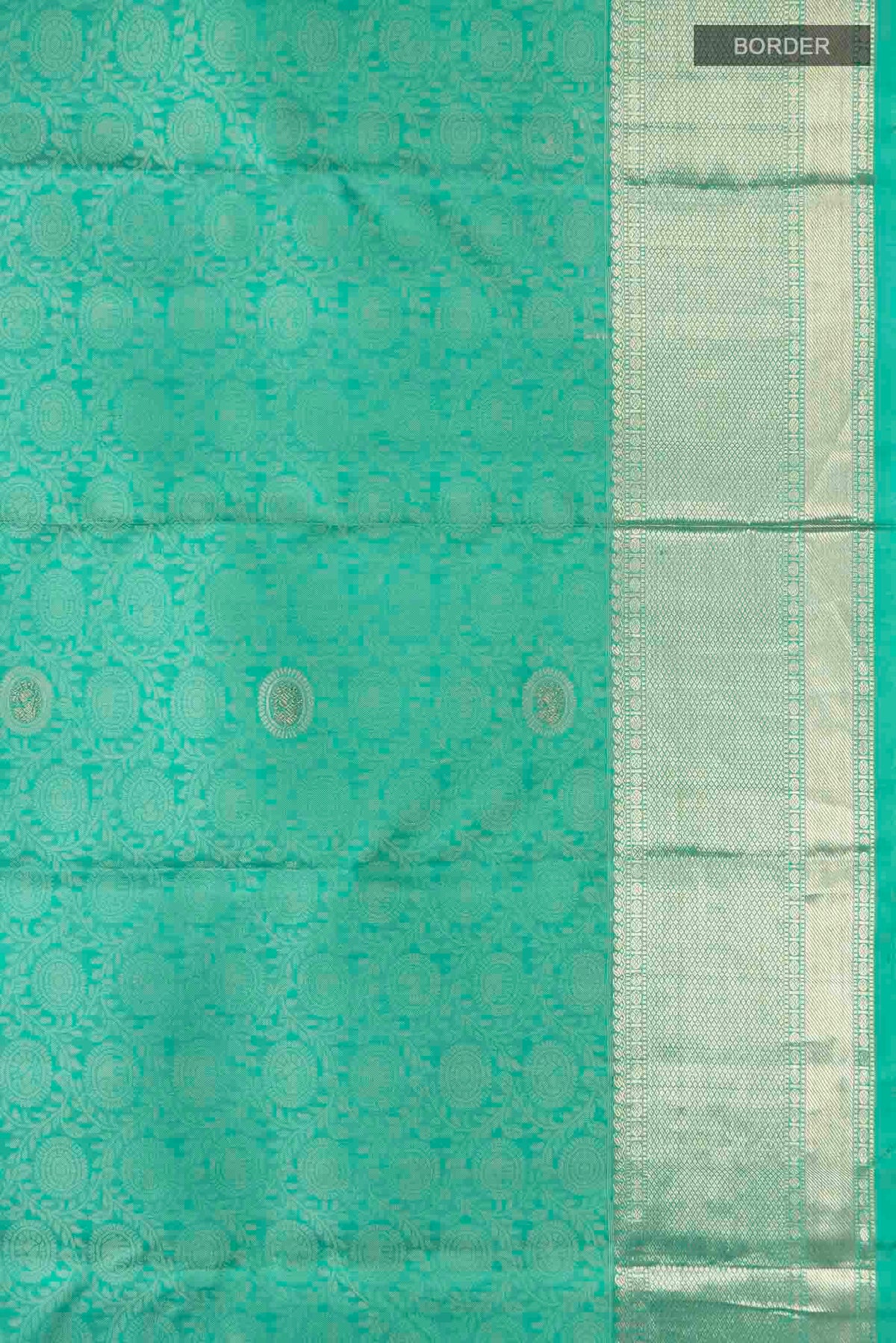 Border image of Turquoise Kanchipuram Silk Saree with Zari And Thread Butta on the body and Zari Border