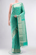 Turquoise Kanchipuram Silk Saree with Zari And Thread Butta on the body and Zari Border displayed on a mannequin