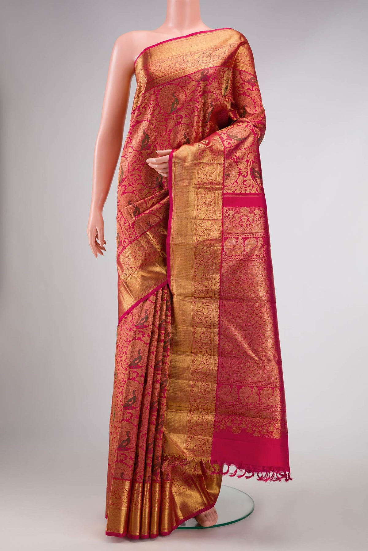 Pure Silk Pure Zari Dark Pink Dual Tone Kanchipuram Saree with Zari Brocade on the body and Zari Border displayed on a mannequin