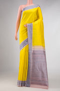 Yellow Kanchipuram Silk Saree with Plain Body and Thread Border displayed on a mannequin