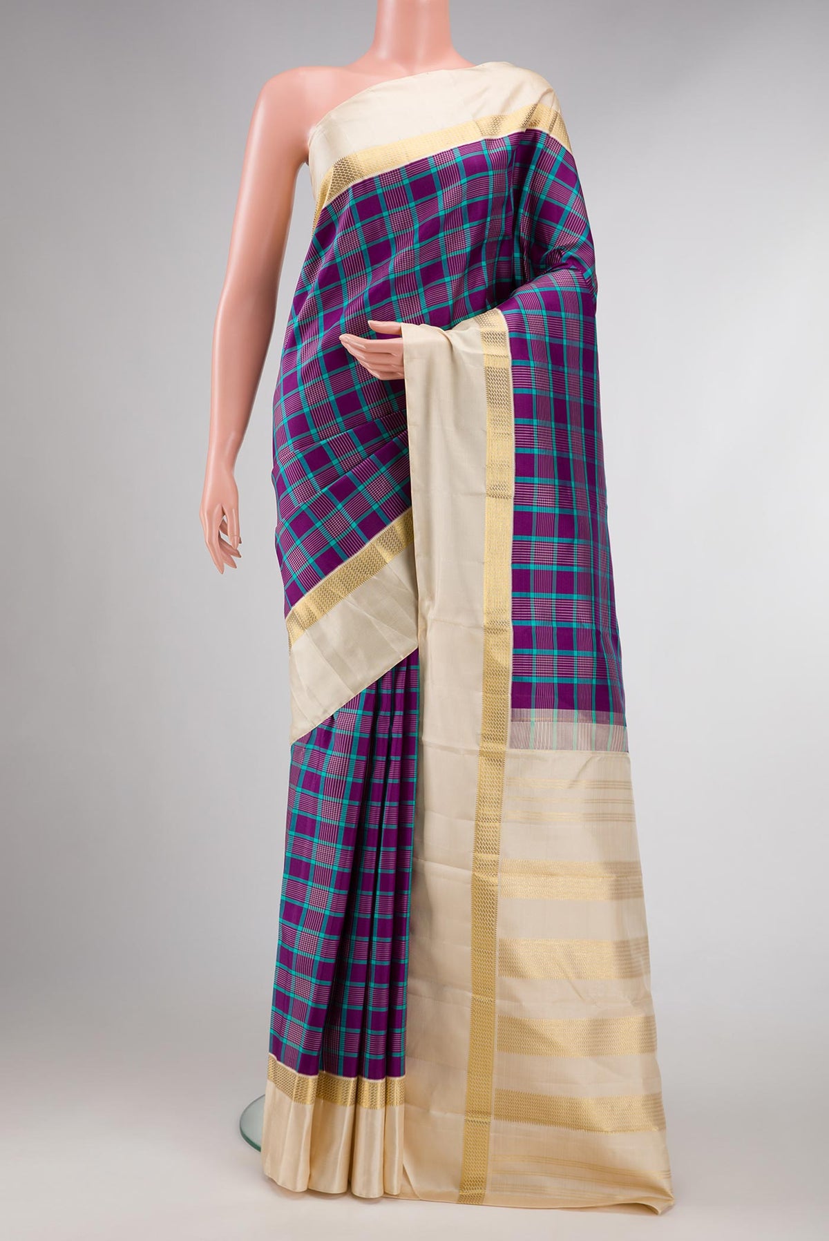Pure Silk Pure Zari Blue Dual Tone Kanchipuram Saree Checked design on the body and Zari Border displayed on a mannequin