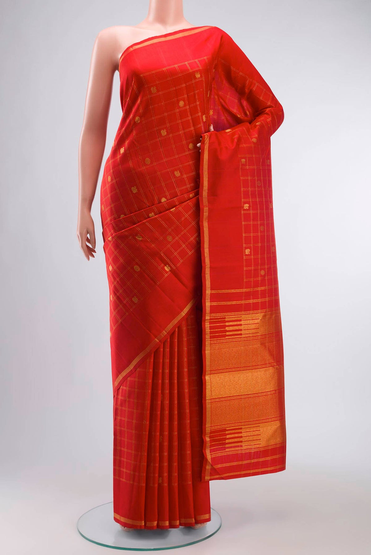 Red Kanchipuram Silk Saree with Zari Butta on the body and Zari Border displayed on a mannequin