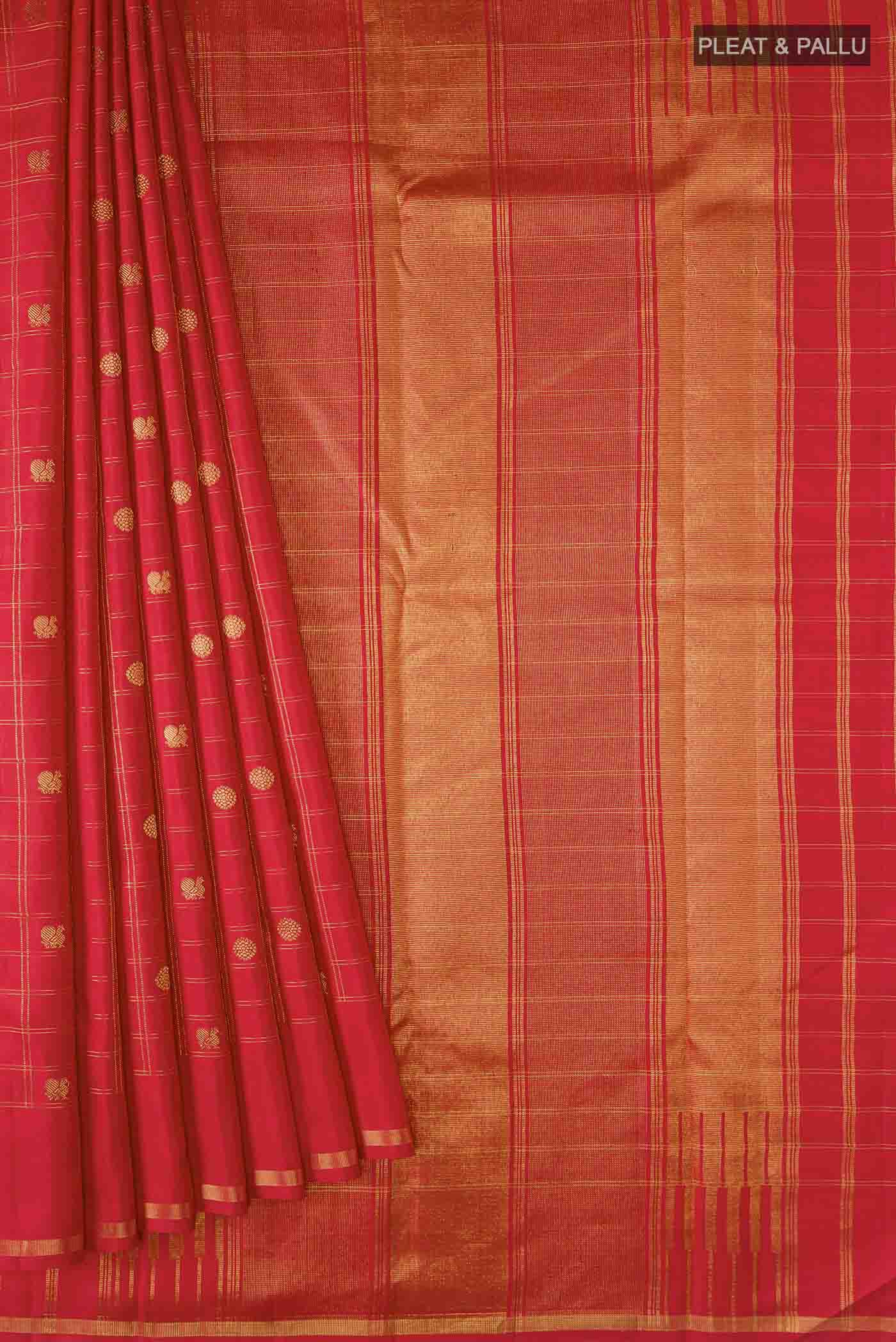 Pleats and pallu of Red Kanchipuram Silk Saree with Zari Butta on the body and Zari Border
