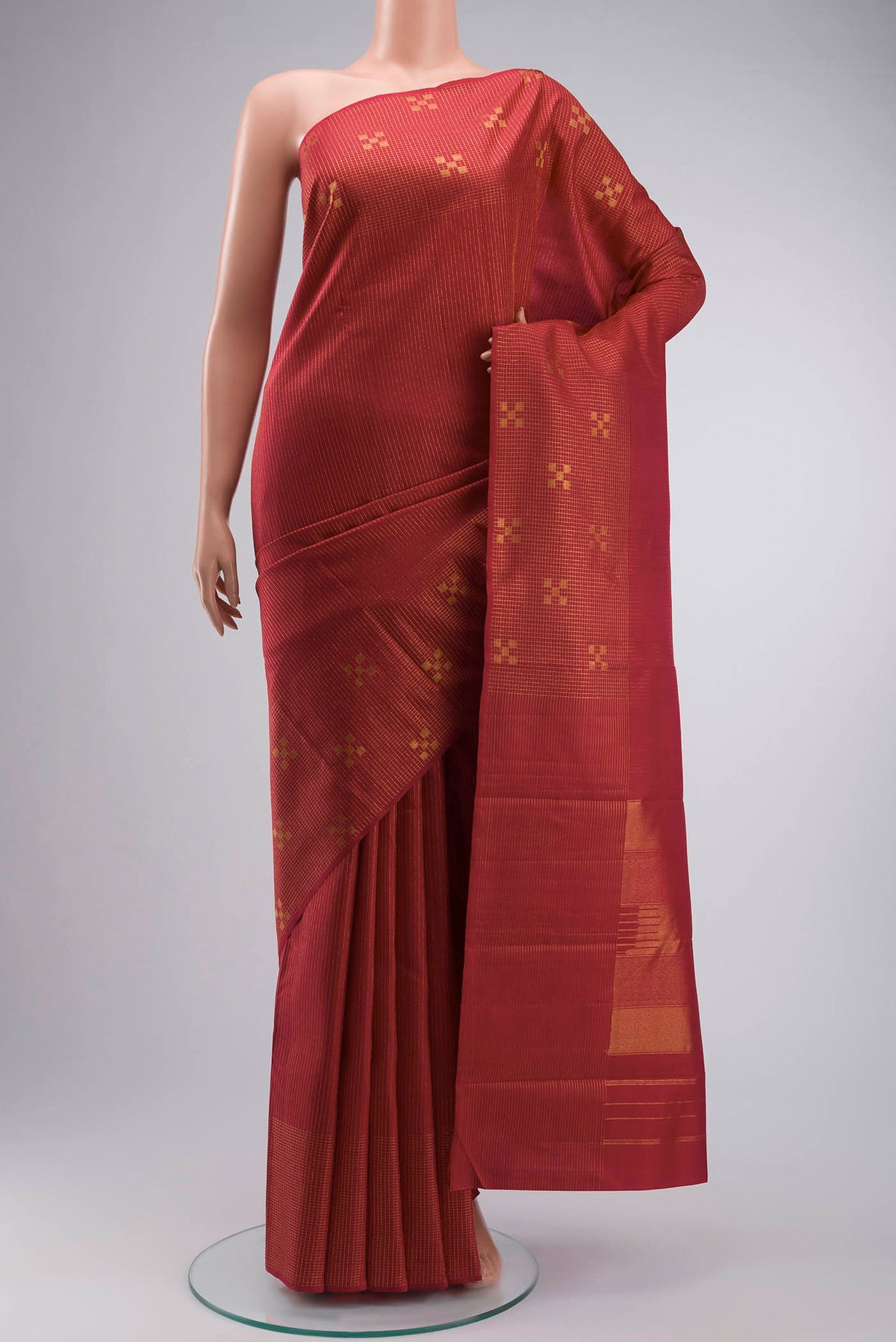 Maroon Kanchipuram Silk Saree with Stripes on the body and Zari Border displayed on a mannequin