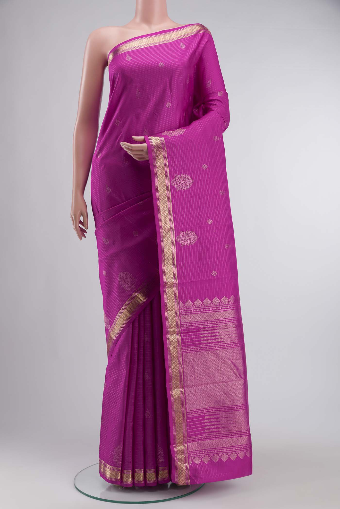 Pink Kanchipuram Silk Saree with Zari Butta on the body and Zari Border displayed on a mannequin