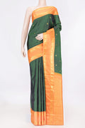 Green Dual Tone Kanchipuram Saree with Zari Butta on the body and Zari Border displayed on a mannequin