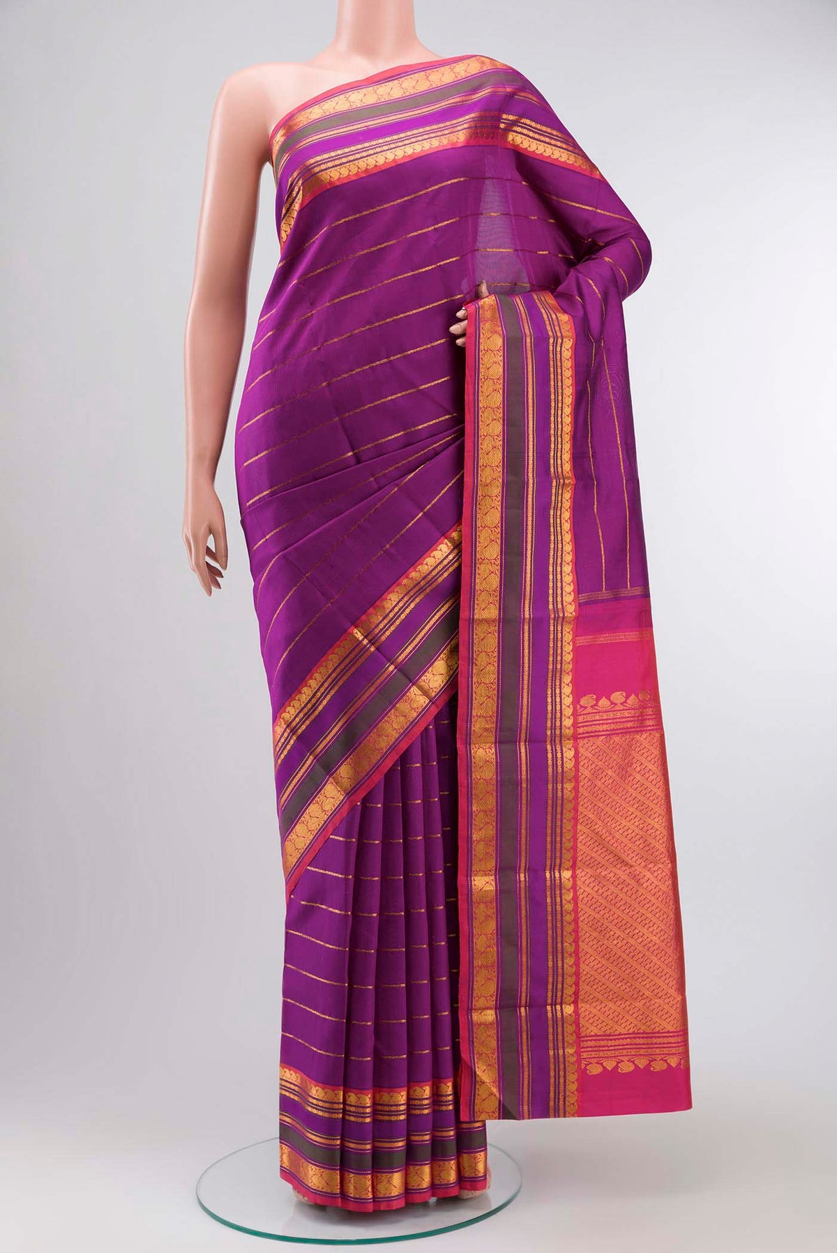 Magenta Kanchipuram Silk Saree with Veldhari on the body and Zari Border displayed on a mannequin