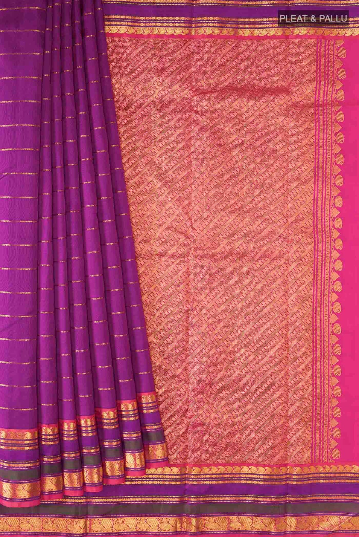 Pleats and pallu of Magenta Kanchipuram Silk Saree with Veldhari on the body and Zari Border
