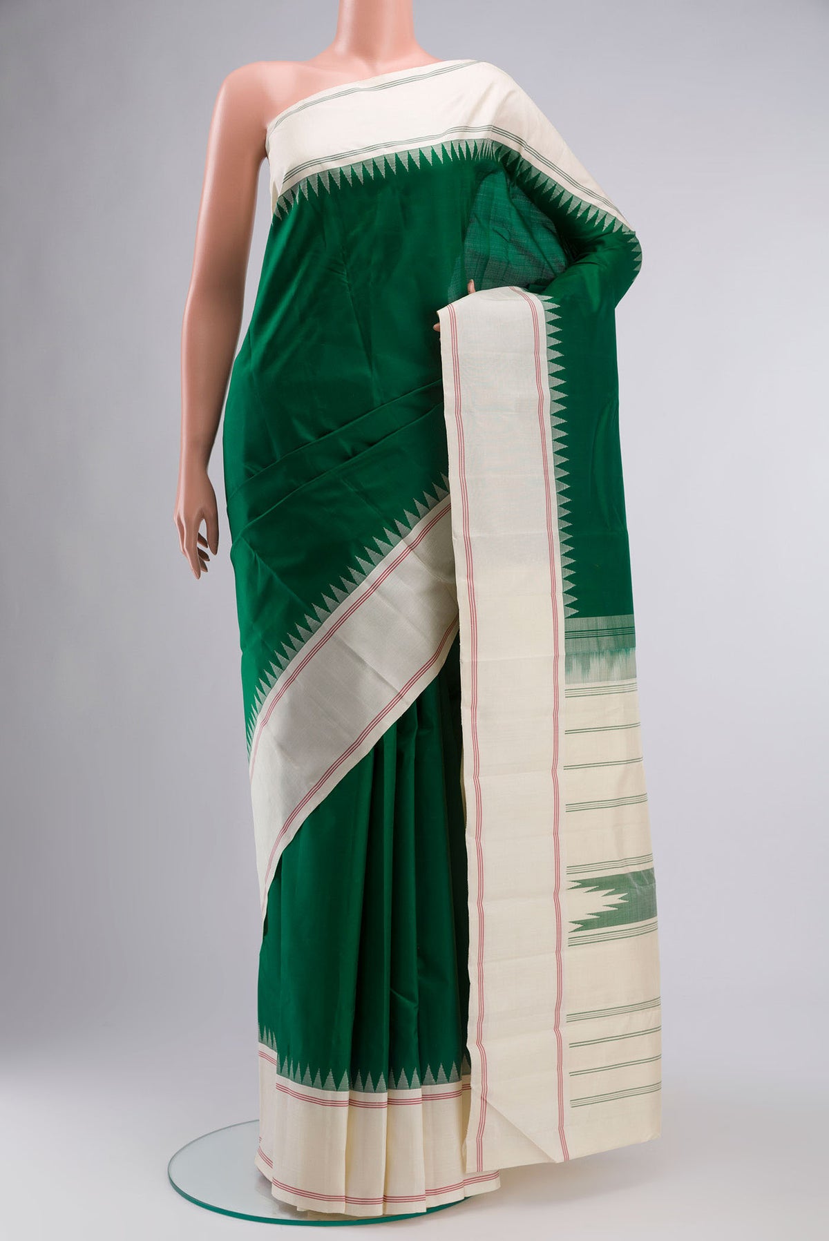 Green Kanchipuram Silk Saree with Plain Body and Plain Border displayed on a mannequin