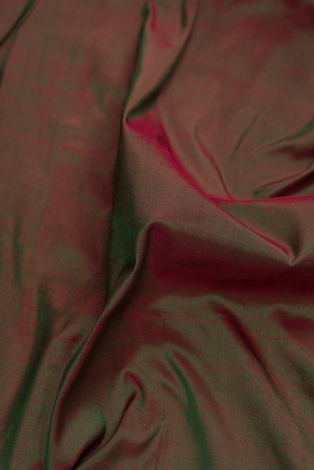 Close up of Bottle Green Dual Tone Kanchipuram Silk Nine Yards Saree with Plain Body and Zari Border.  displaying folds