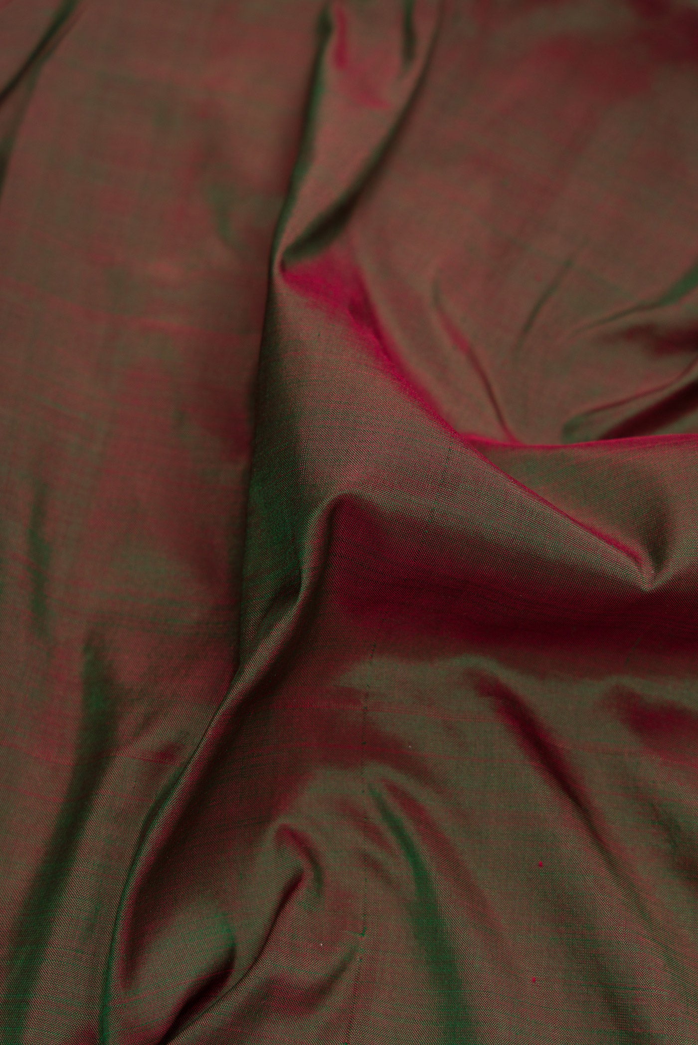 Close up of Bottle Green Dual Tone Kanchipuram Silk Nine Yards Saree with Plain Body and Zari Border.  displaying folds