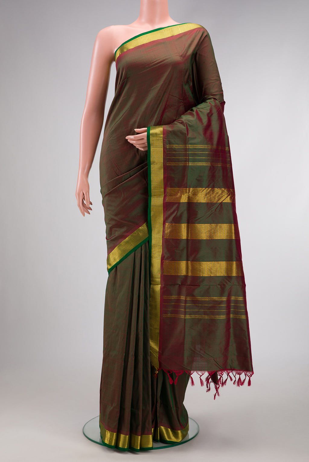 Bottle Green Dual Tone Kanchipuram Silk Nine Yards Saree with Plain Body and Zari Border.  displayed on a mannequin
