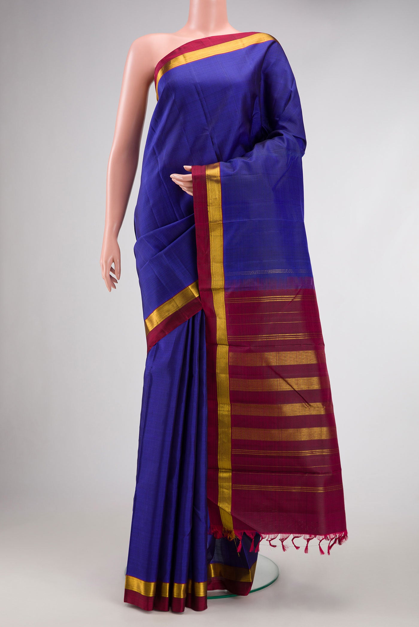 Royal Blue Dual Tone Kanjivaram Silk Saree with Plain Body and Zari Border.  displayed on a mannequin