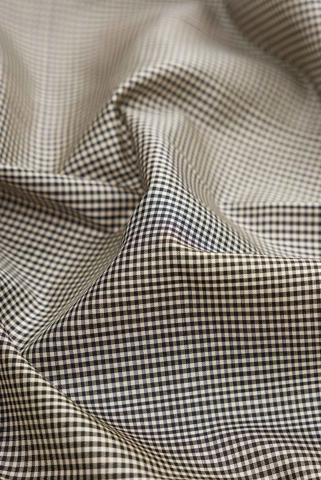 Close up of Off White Dual Tone Kanchipuram Silk Saree with Plain Body and Temple Border.  displaying folds