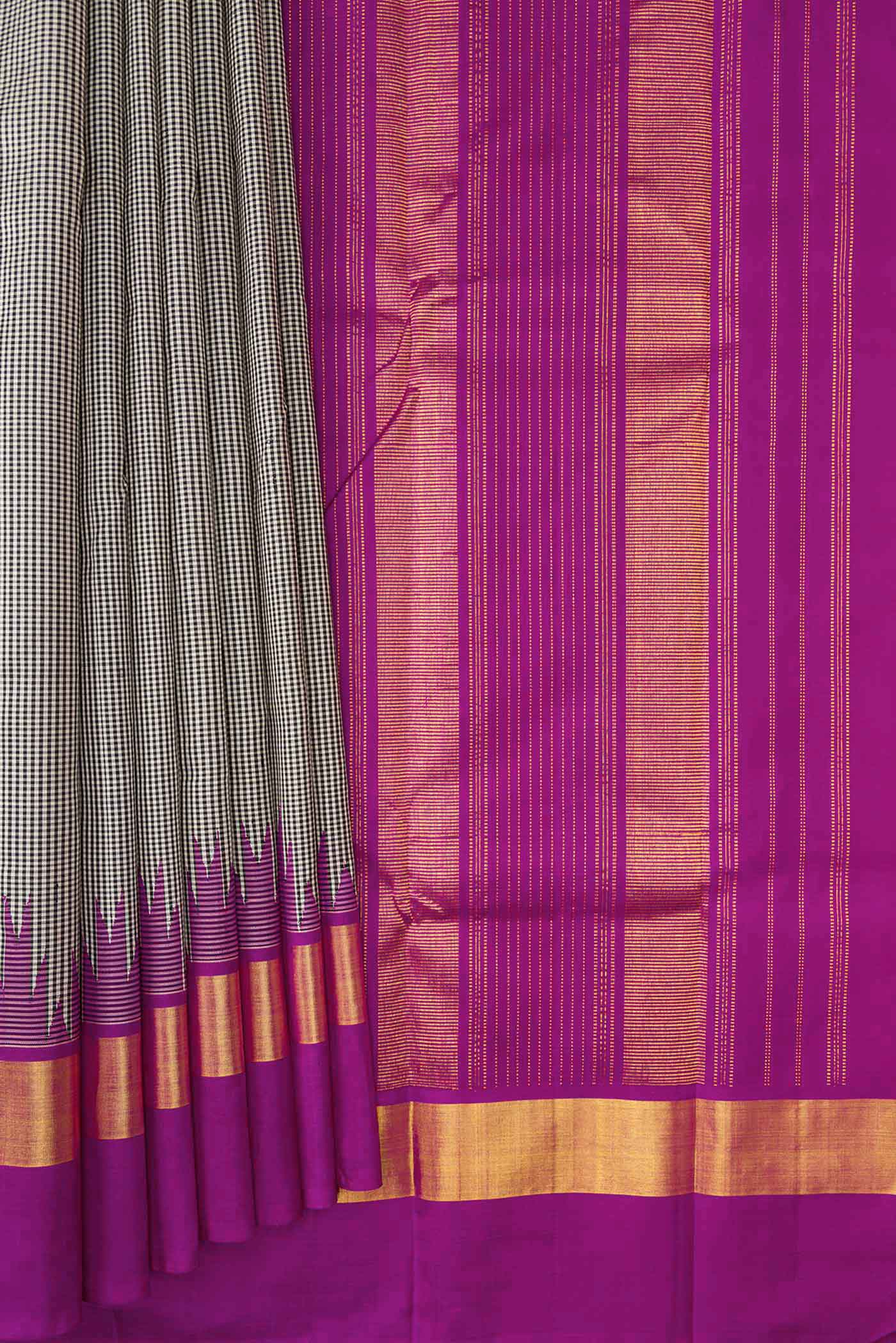 Pleats and pallu of Off White Dual Tone Kanchipuram Silk Saree with Plain Body and Temple Border. 