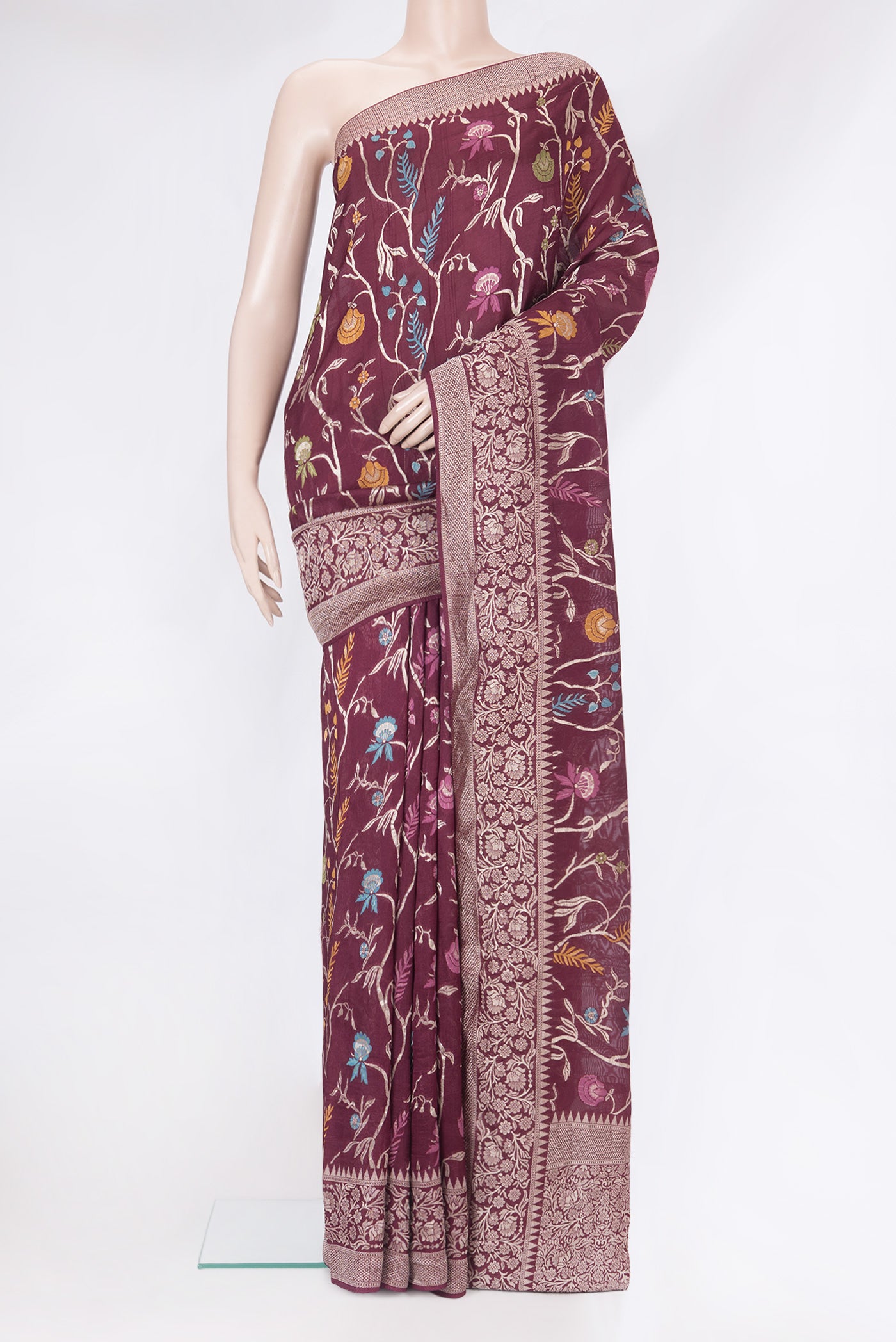Burgundy Blended Banarasi Silk Saree with Zari Brocade on the body and Zari Border.  displayed on a mannequin