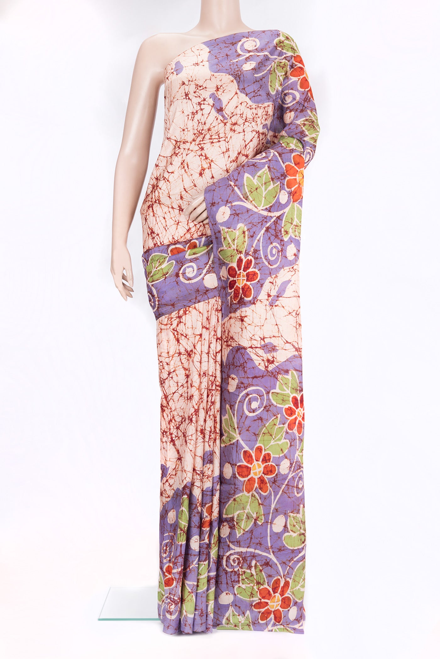 Peach Dual Tone Printed Silk Saree with Batik Print on the body and Printed Border.  displayed on a mannequin