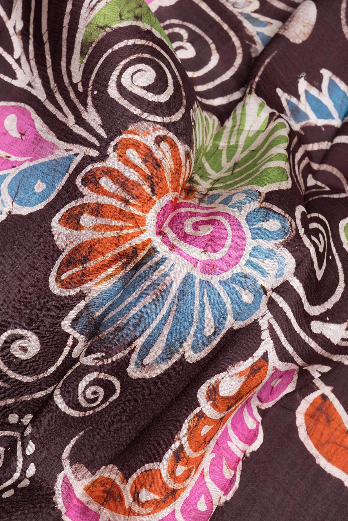 Close up of Coffee Brown Printed Silk Saree with Printed design on the body and Fancy Border.  displaying folds