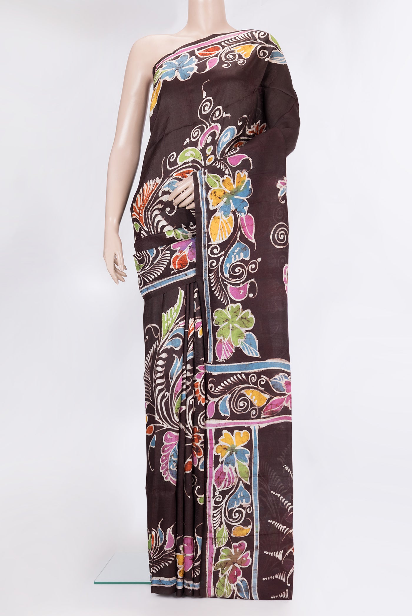 Coffee Brown Printed Silk Saree with Printed design on the body and Fancy Border.  displayed on a mannequin
