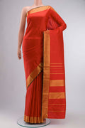 Red Kanchipuram Silk Saree Checked design on the body and Zari Border displayed on a mannequin