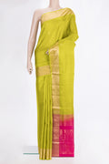 Pure Silk Parrot Green Soft Saree with Zari Butta on the body and Zari Border.  displayed on a mannequin