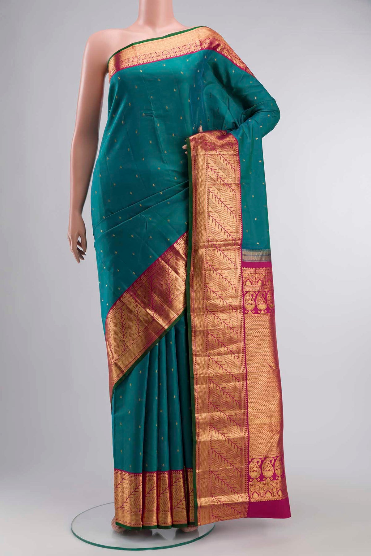 Blue Kanchipuram Silk Saree with Zari Butta on the body and Zari Border displayed on a mannequin