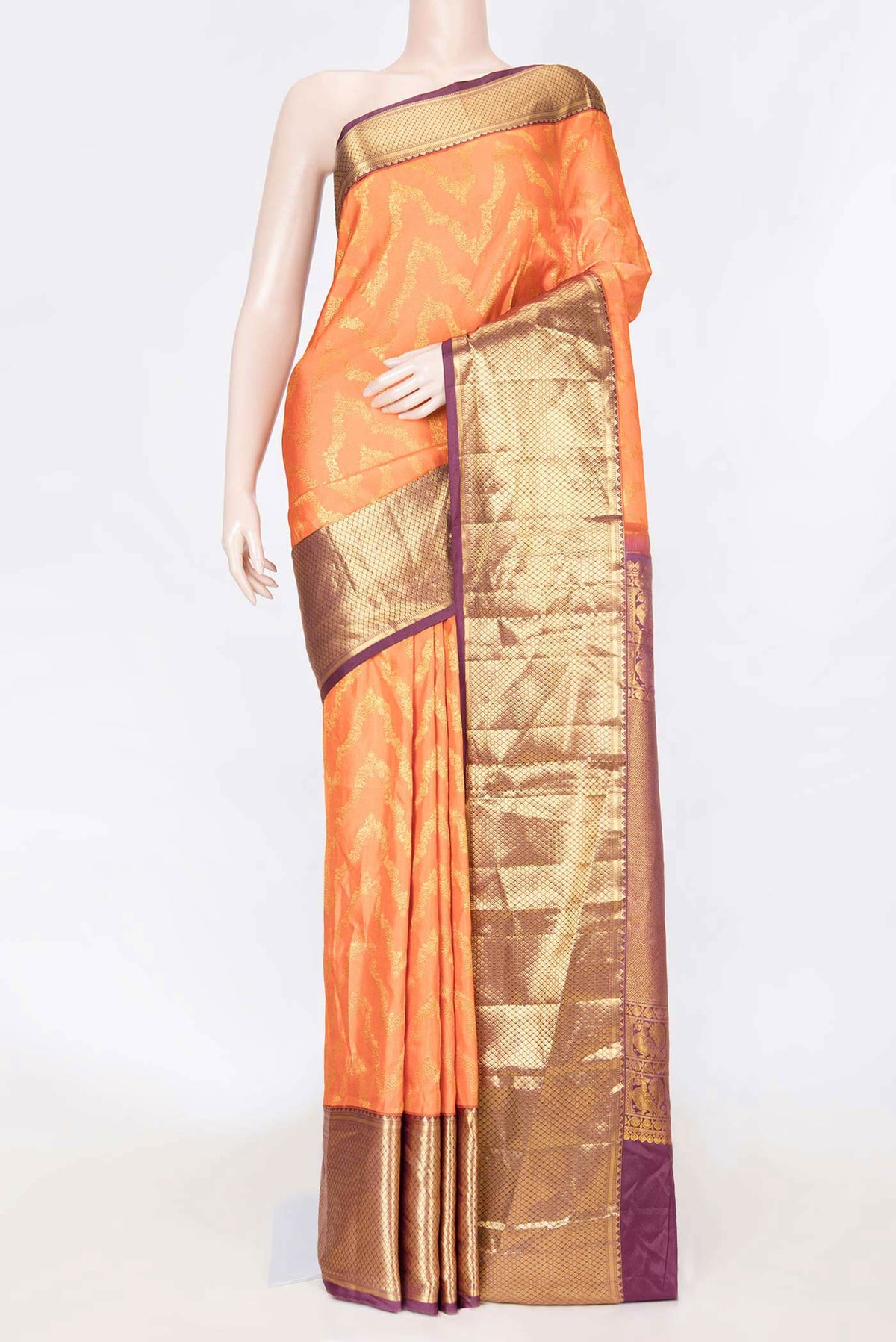 Orange Dual Tone Kanchipuram Saree with Zari Brocade on the body and Zari Border displayed on a mannequin