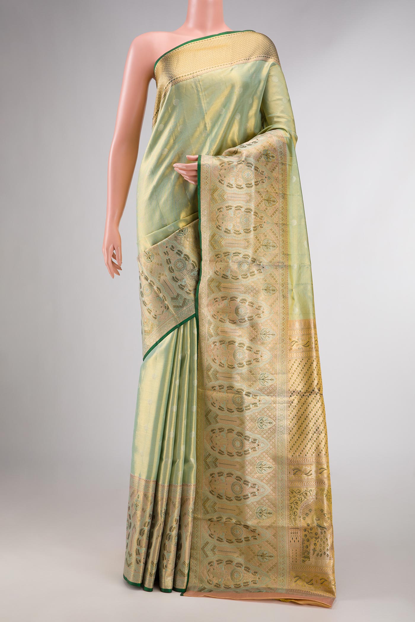 Pista Green Dual Tone Kanchipuram Tissue Silk Saree with Zari Brocade on the body and Zari Border displayed on a mannequin