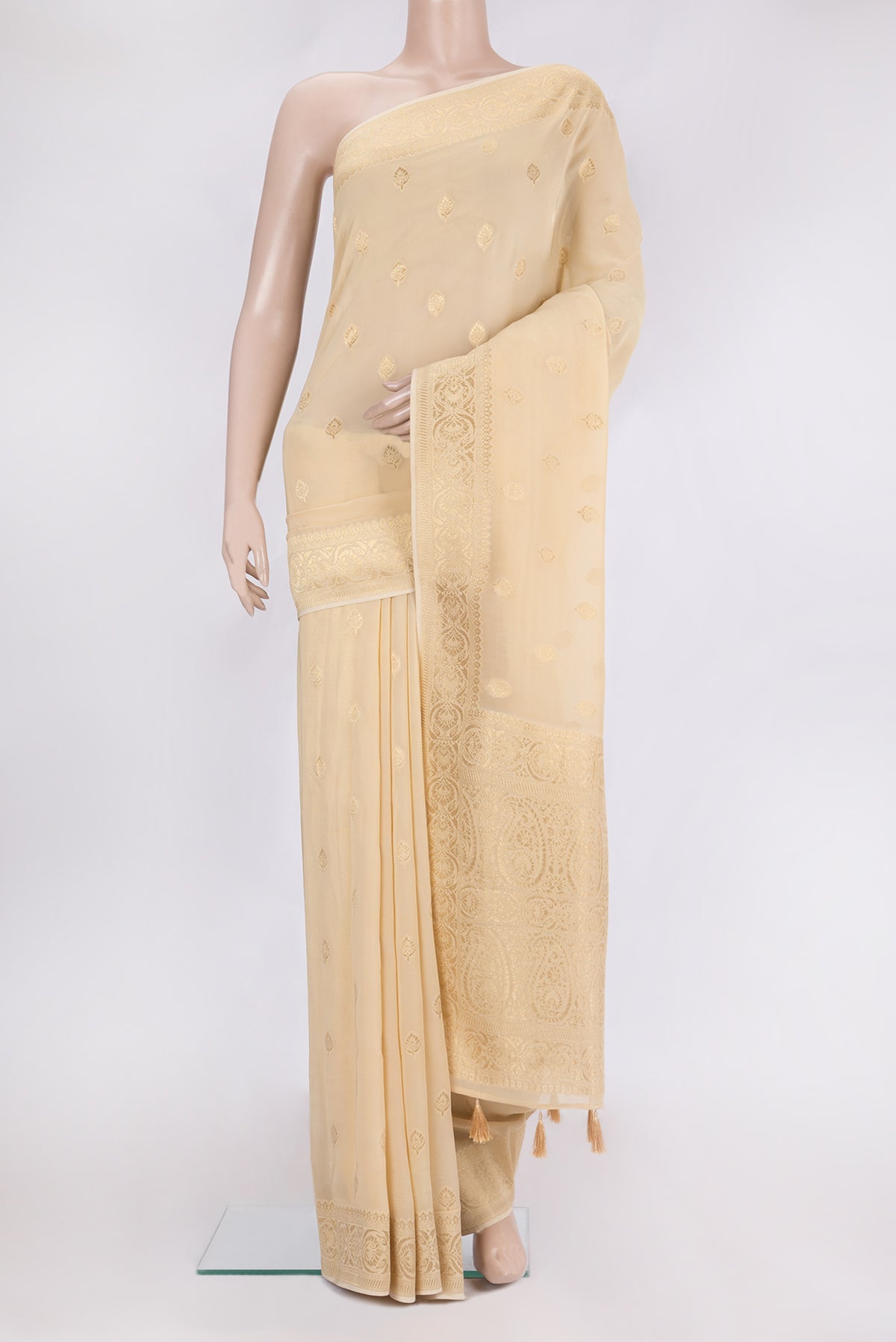 Sandal Blended Banarasi Georgette Saree with Zari Butta on the body and Zari Border.  displayed on a mannequin