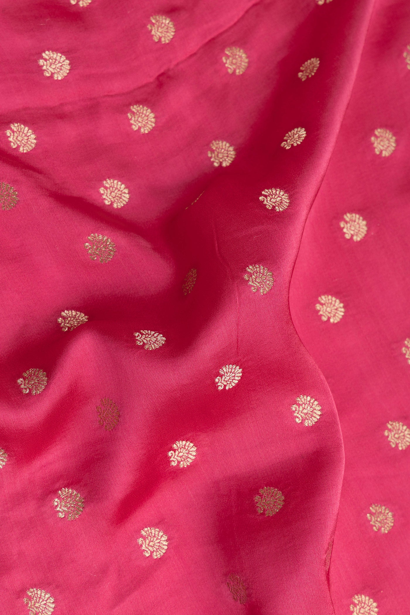 Close up of Pink Blended Banarasi Silk Saree with Zari Butta on the body and Zari Border.  displaying folds