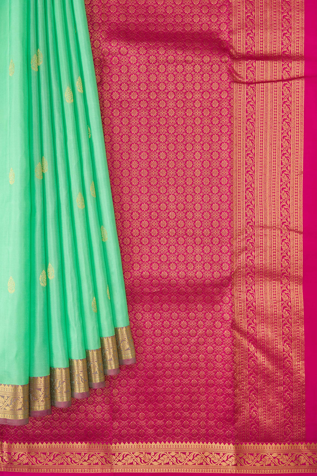 Pleats and pallu of Pista Green Dual Tone Kanjivaram Silk Saree with Zari Butta on the body and Zari Border. 
