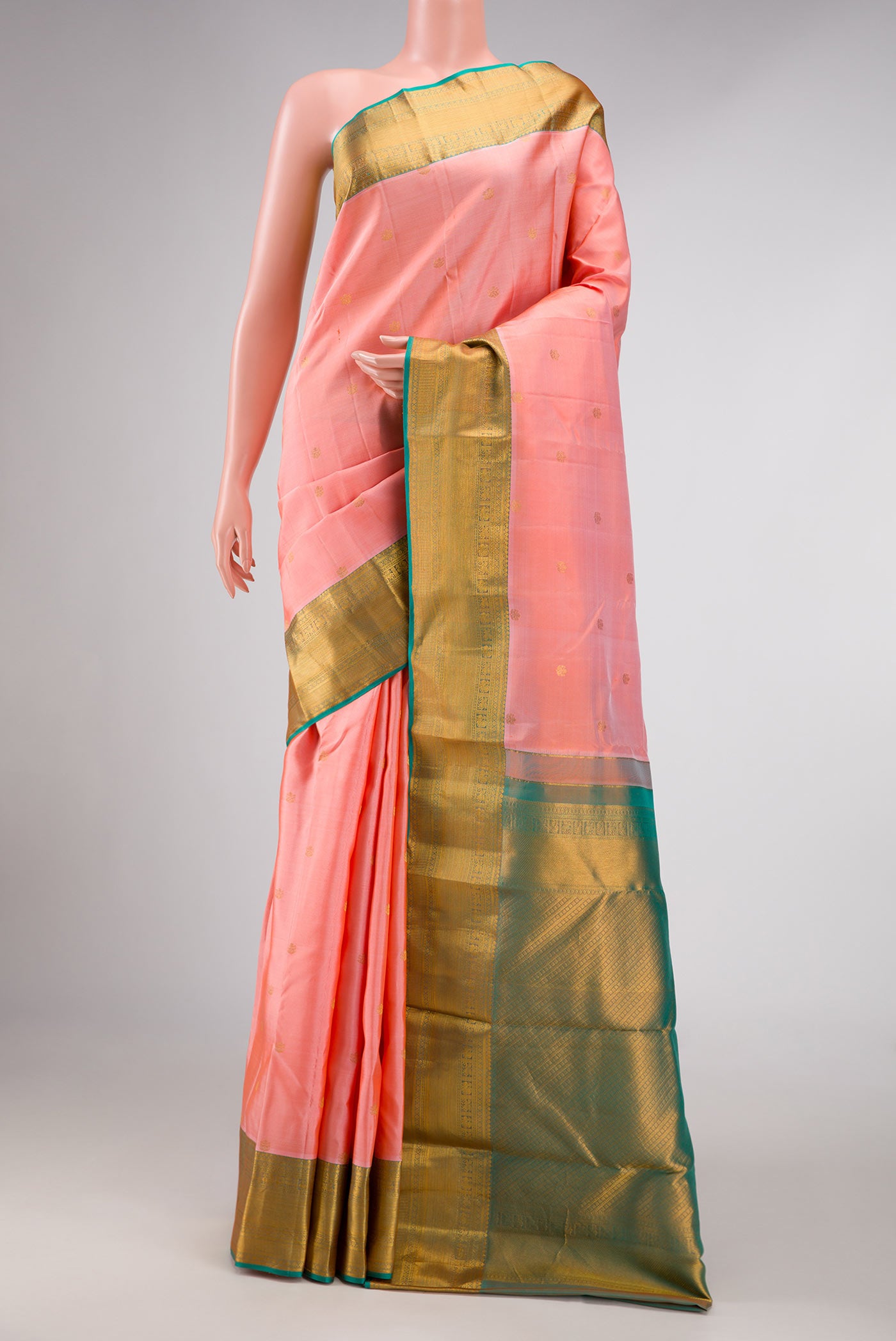 Pink Dual Tone Kanchipuram Silk Saree with Zari Butta on the body and Zari Border displayed on a mannequin