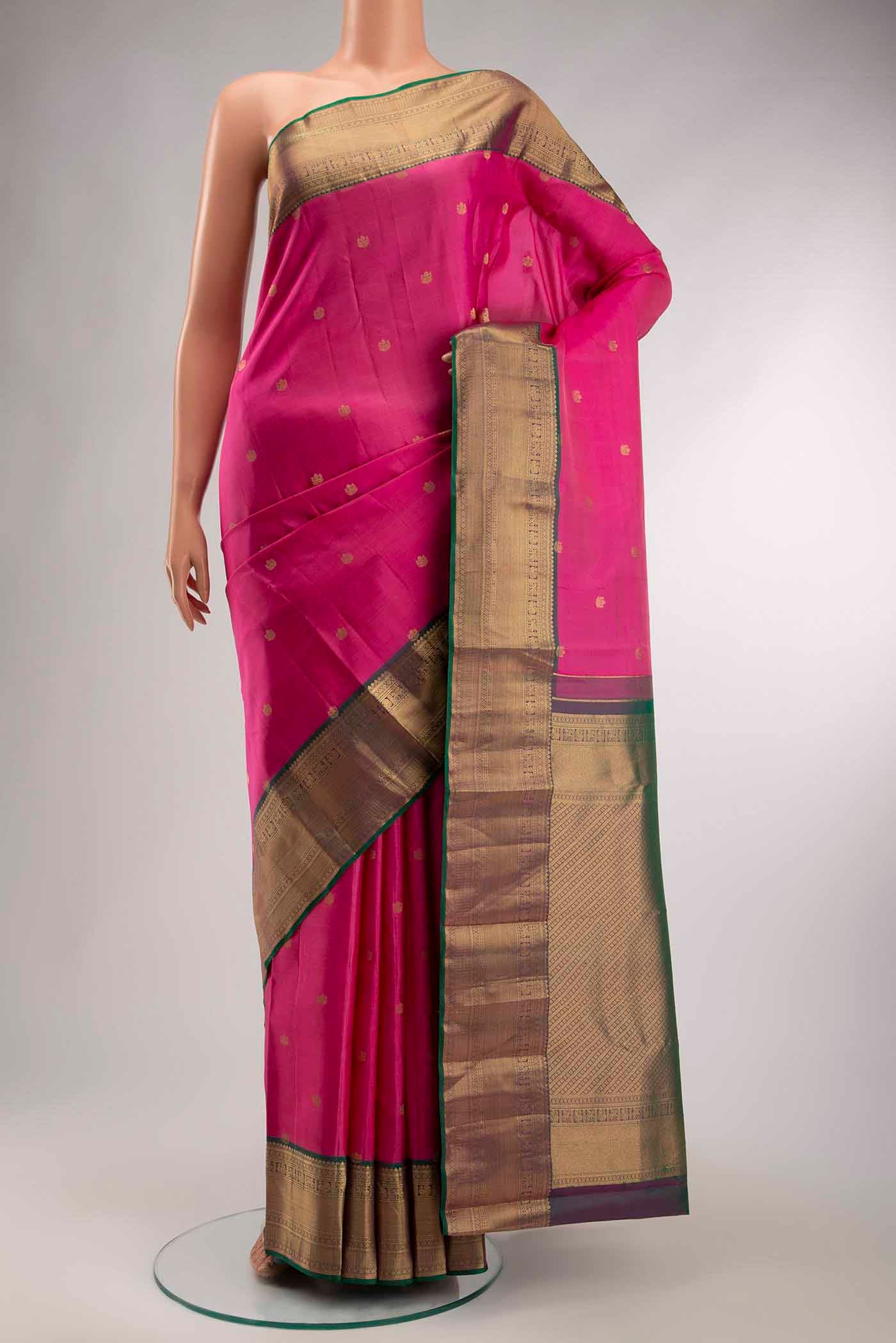 Pink Kanchipuram Silk Saree with Zari Butta on the body and Zari Border displayed on a mannequin
