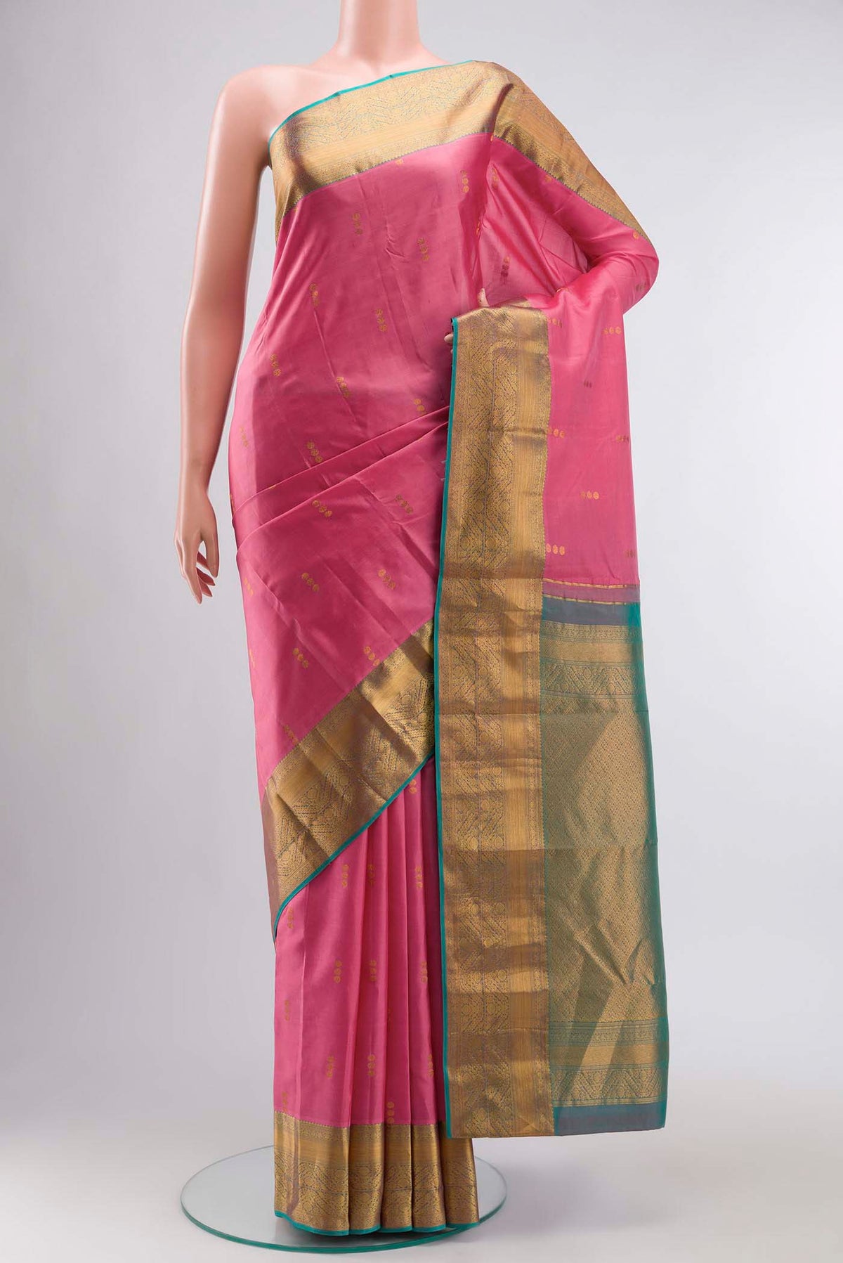 Pink Kanchipuram Silk Saree with Zari Butta on the body and Zari Border displayed on a mannequin
