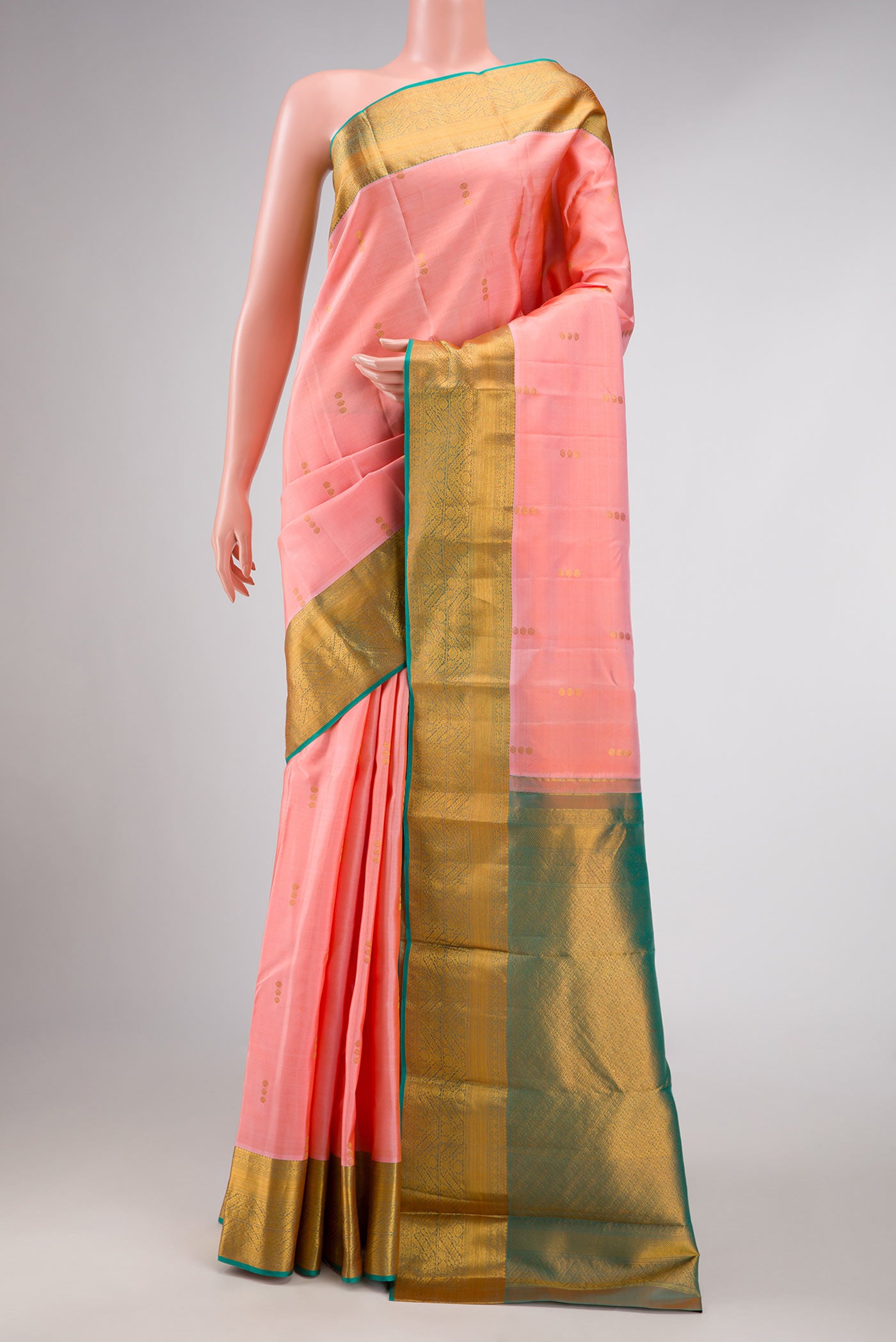 Pink Dual Tone Kanchipuram Silk Saree with Zari Butta on the body and Zari Border displayed on a mannequin