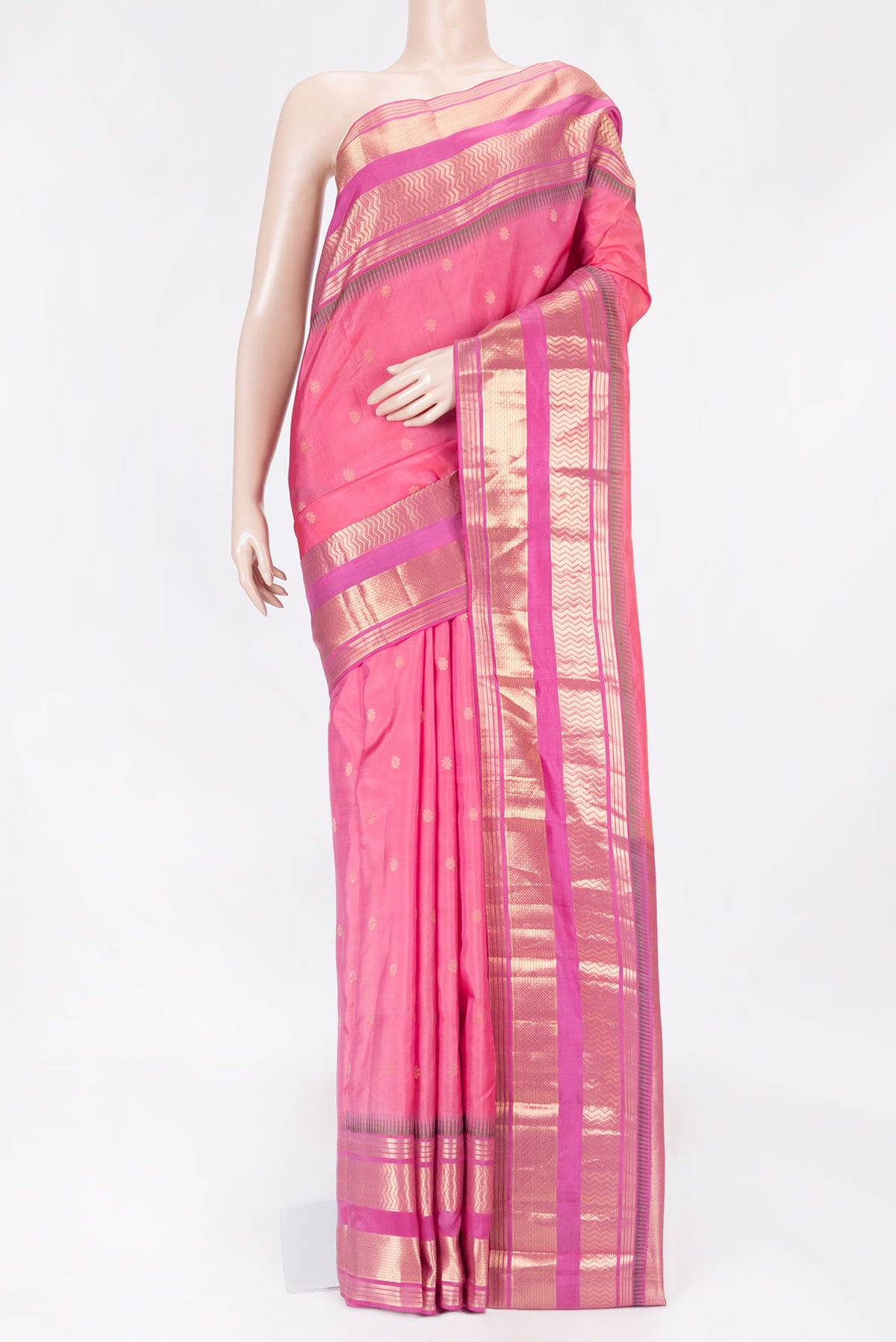 Rose pink Dual Tone Kanchipuram Saree with Zari Butta on the body and Zari Border displayed on a mannequin