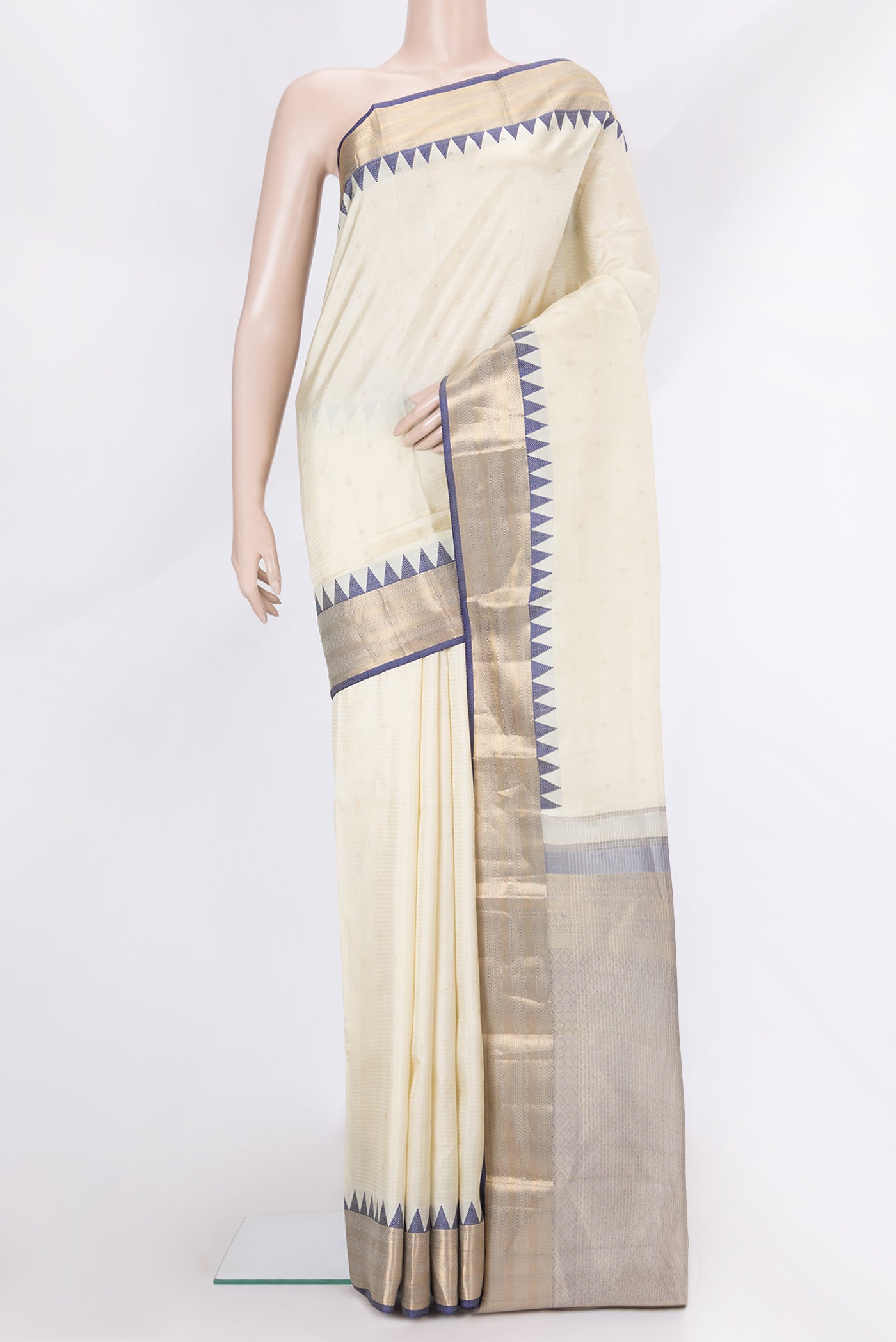 Off White Dual Tone Kanchipuram Silk Saree with Zari Butta on the body and Zari And Thread Border.  displayed on a mannequin