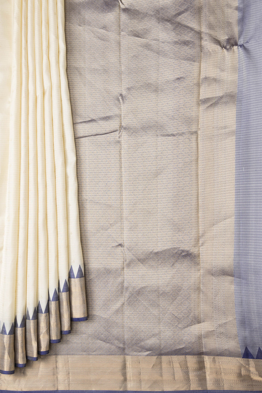 Pleats and pallu of Off White Dual Tone Kanchipuram Silk Saree with Zari Butta on the body and Zari And Thread Border. 