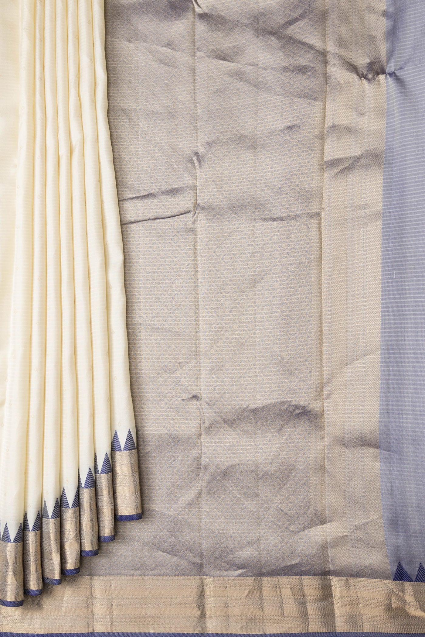 Pleats and pallu of Off White Dual Tone Kanchipuram Silk Saree with Zari Butta on the body and Zari And Thread Border. 