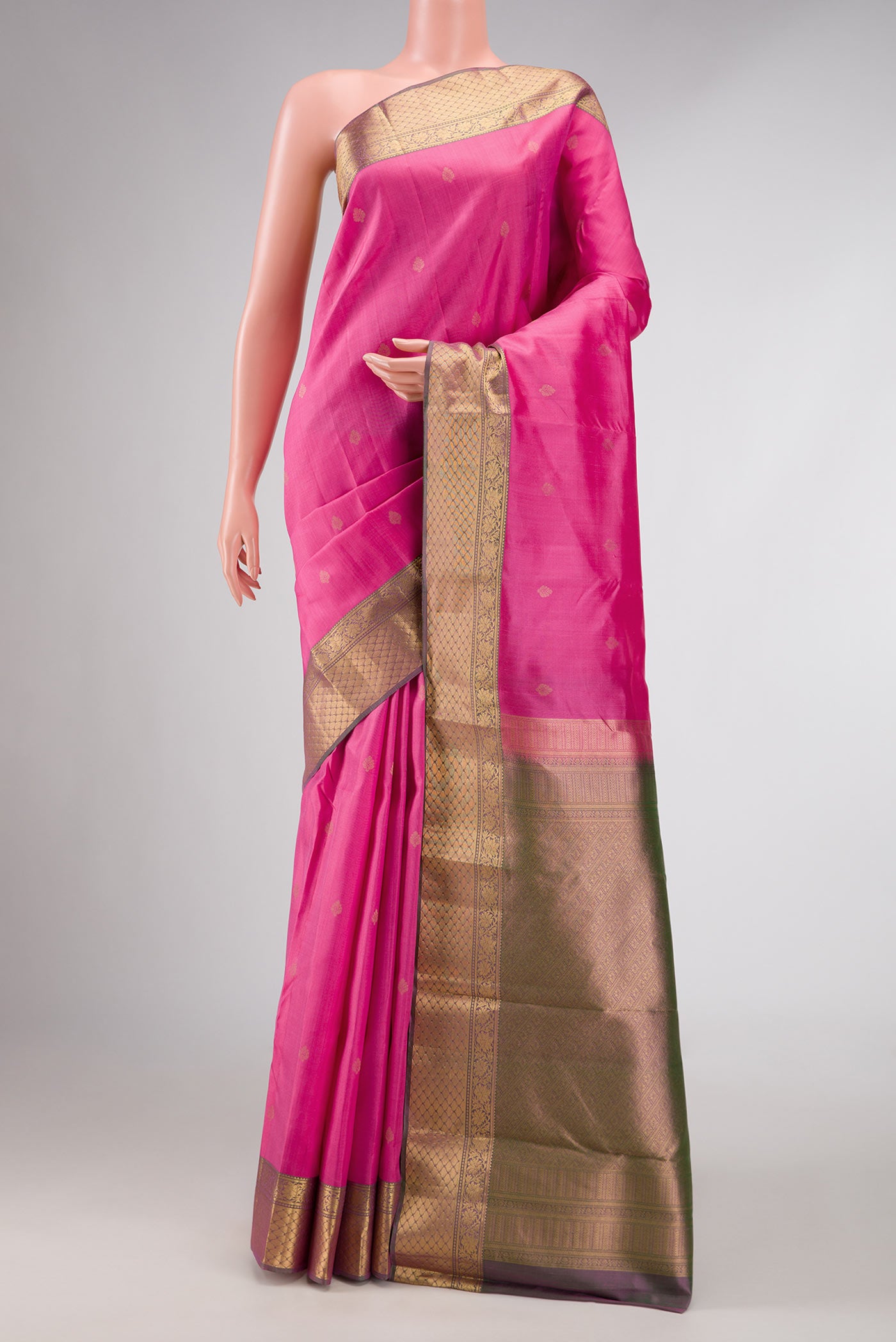 Pink Dual Tone Kanchipuram Silk Saree with Zari Butta on the body and Zari Border displayed on a mannequin