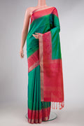 Green Dual Tone Soft Silk Saree with Zari Butta on the body and Zari Border displayed on a mannequin