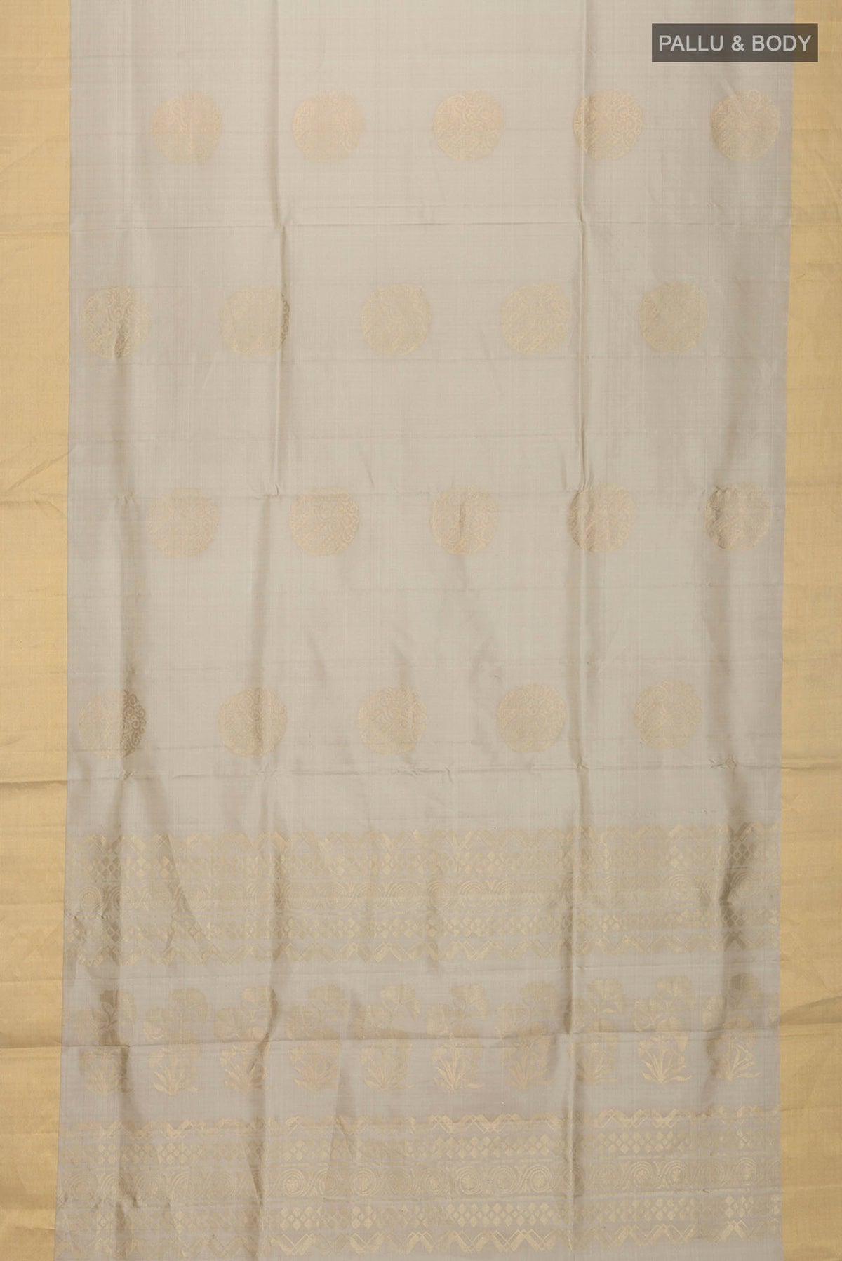 Flat view of Green Soft Silk Saree with Zari Butta on the body and Zari Border