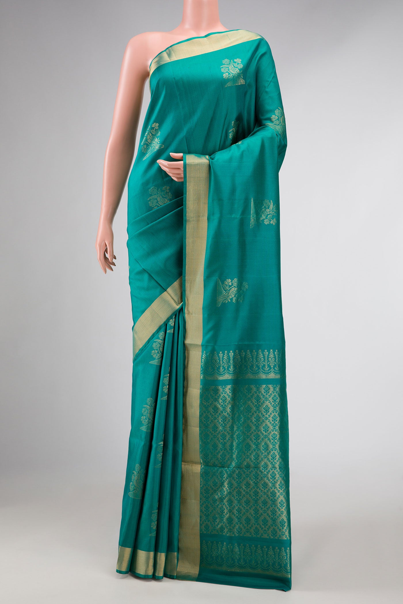 Blue Dual Tone Soft Silk Saree with Zari Butta on the body and Zari Border displayed on a mannequin