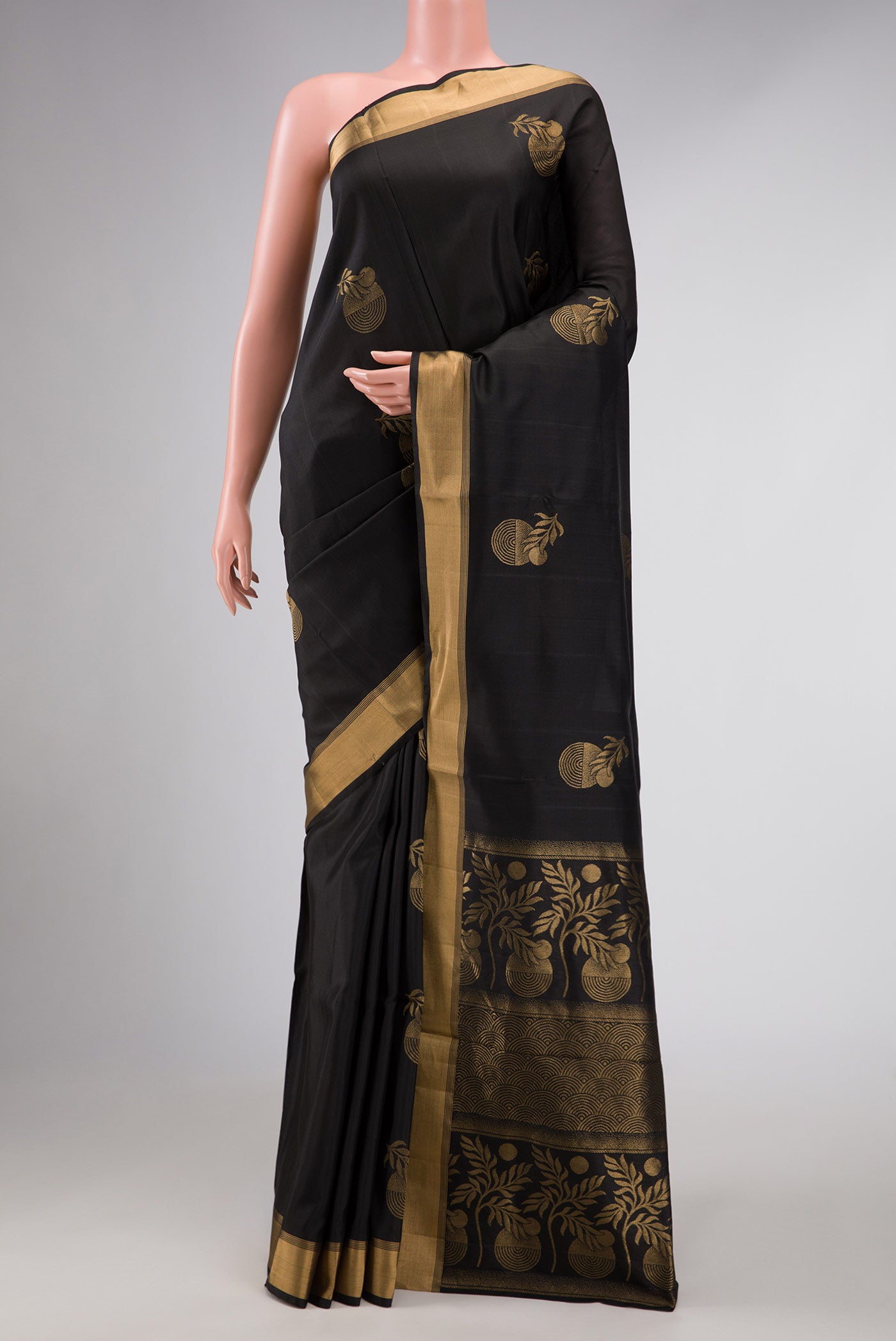Black Dual Tone Soft Silk Saree with Zari Butta on the body and Zari Border displayed on a mannequin