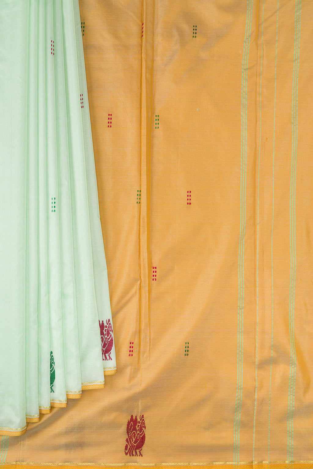 Pleats and pallu of Pista Green Kanchipuram Silk Saree with Thread Butta on the body and Fancy Border. 