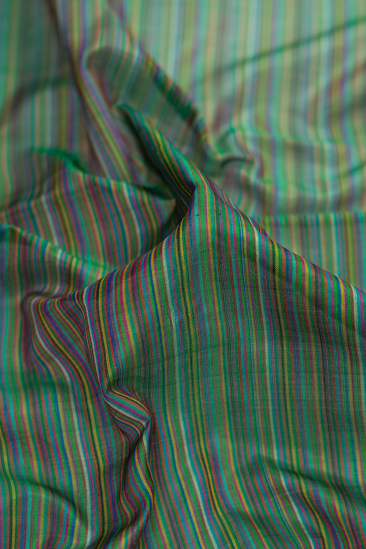 Close up of Mehandi Green Dual Tone Kanjivaram Silk Saree with Stripes on the body and Zari Border.  displaying folds