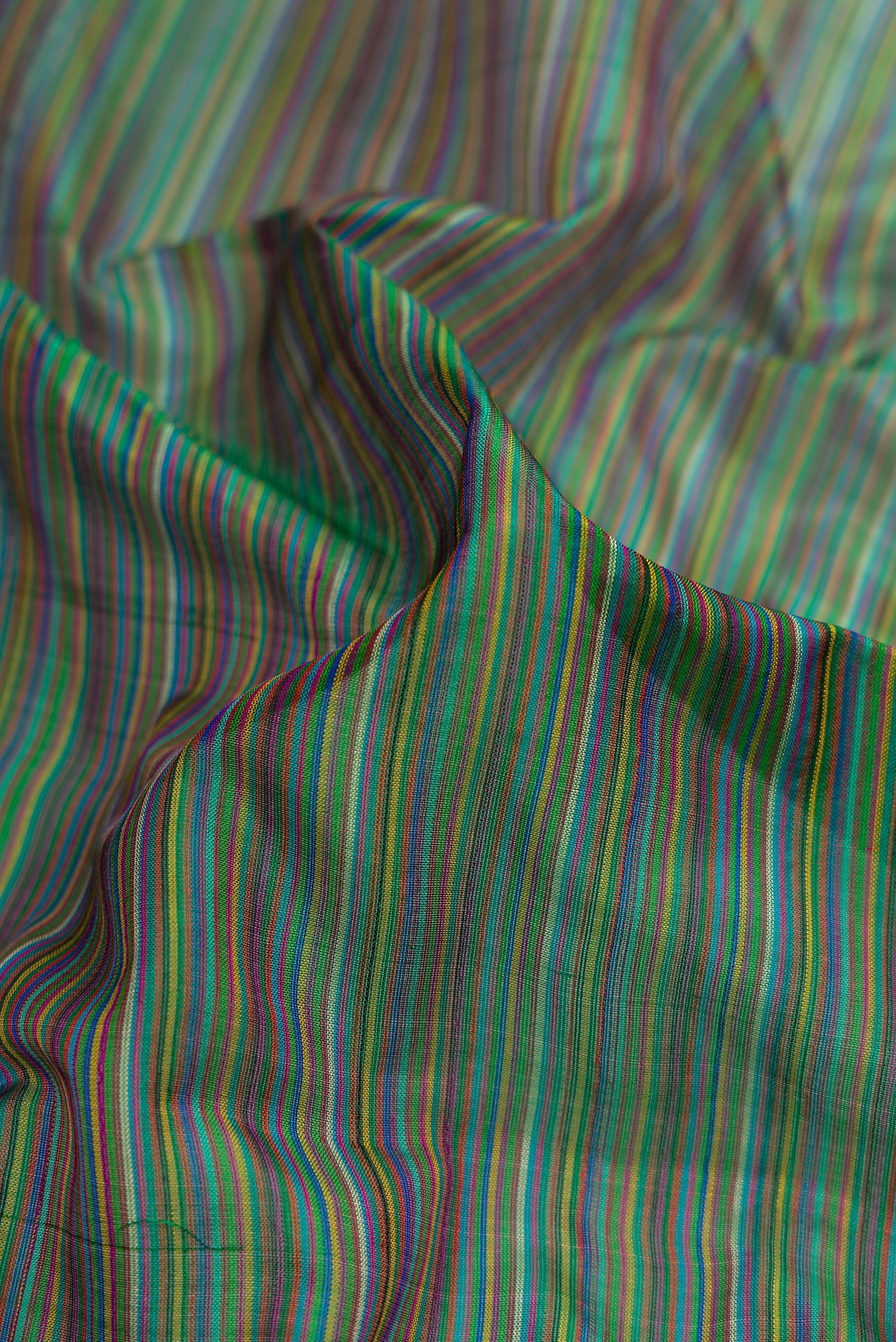 Close up of Mehandi Green Dual Tone Kanjivaram Silk Saree with Stripes on the body and Zari Border.  displaying folds