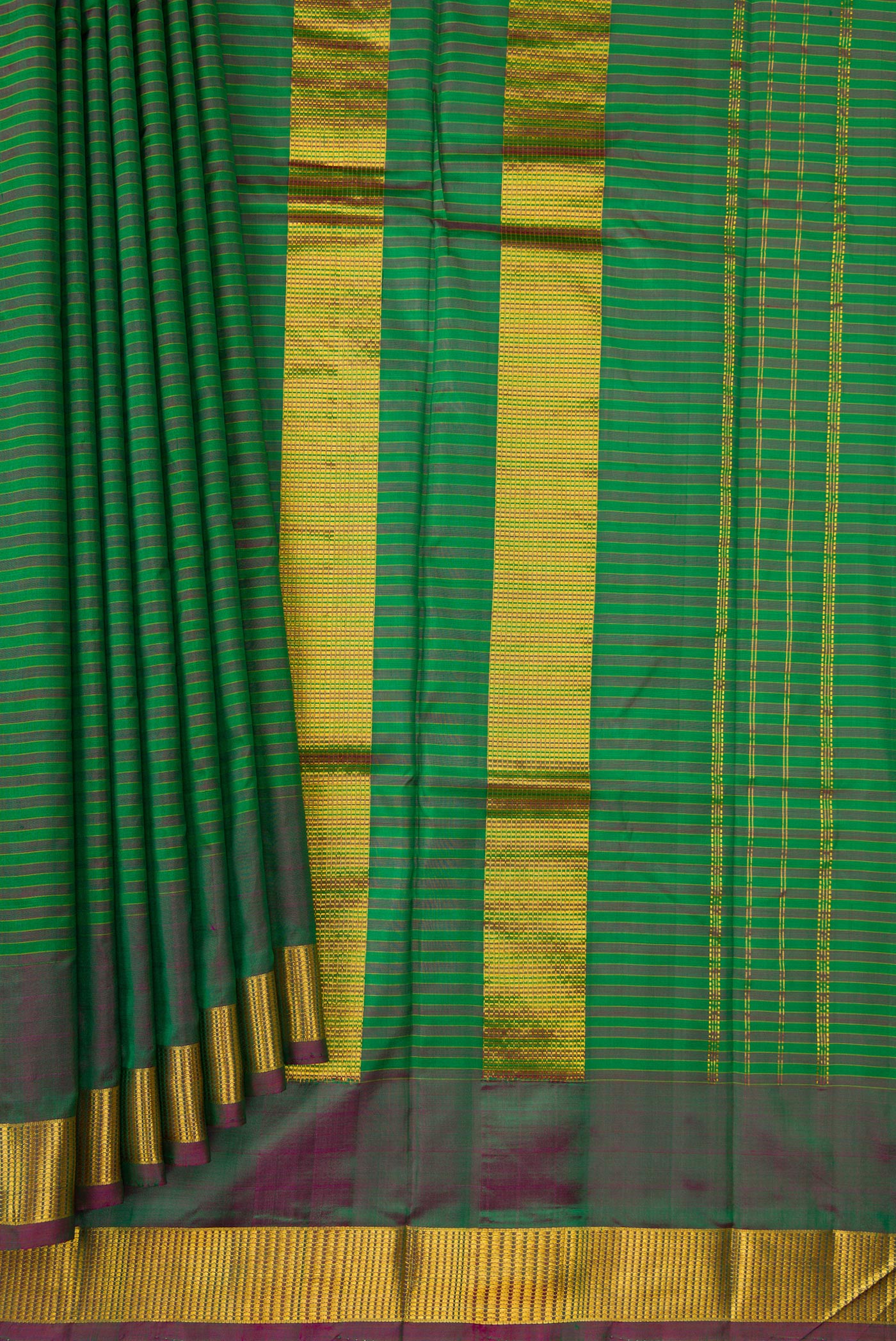 Pleats and pallu of Green Dual Tone Kanjivaram Silk Saree with Stripes on the body and Zari Border. 