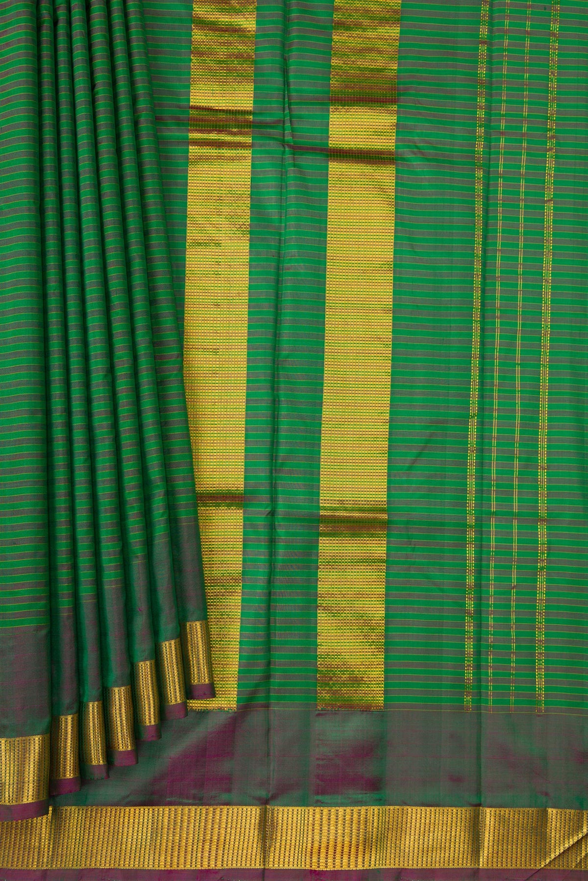 Pleats and pallu of Green Dual Tone Kanjivaram Silk Saree with Stripes on the body and Zari Border. 